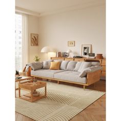 a living room scene with focus on the couch and coffee table in the foreground