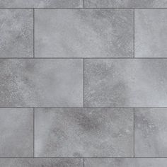 a close up view of a gray tile floor with no grouting on it