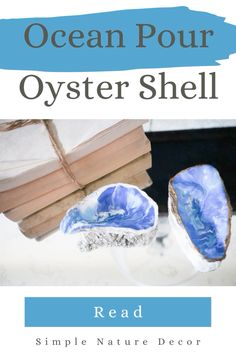 an ocean pour oyster shell next to a stack of books with the title, read simple nature decor