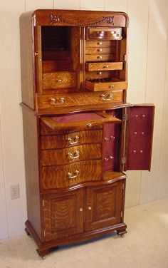 an old fashioned wooden cabinet with drawers