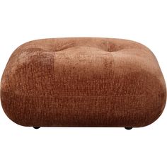 a brown ottoman sitting on top of a white floor