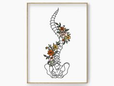 a framed print with flowers on it in front of a white wall and wooden frame