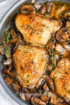 chicken thighs with mushrooms in a skillet