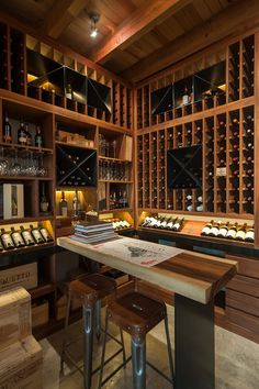 a wine cellar with lots of bottles in it