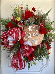 A deco mesh wreath created using a evergreen wreath form in reds, burlaps, creams and greens, accented with coordinating ribbons, florals, and a home sweet home sign.  Most of my deco mesh wreaths range in size from 24"-26" wide, by 7-10" thick.  These CANNOT be put between your storm door and regular door.  While I try my best to ensure I use the highest quality of florals that are best for outdoors, it's best to keep your wreath where it is protected from the elements. In due time some colors Alpine Texas, Home Wreath, Wreath Sunflower, Evergreen Wreath, Sunflower Wreath, Wreath Summer, Sunflower Wreaths, Wreath Forms, Deco Mesh Wreaths