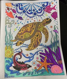 a coloring book with an image of a turtle and other sea animals in the ocean