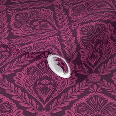 a pink and purple wallpaper with an intricate design on it's surface,