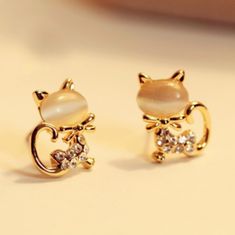 Super Cute Opal Cat Kitty Crystal Stud Earrings. Color Beige Stone. Semi-Precious. Metal (Alloy) Color Gold. Pushback Closure. Silver Tone Also Available. Brand New Boutique Jewelry. Bundle For Discount And To Save On Shipping! Tags: Korean Fashion, Party, Animal, Wild Cat, Kitty, Kitten, Creative, Unique, Gift, Minimalist, Sweet, Kawaii, Girly Ear Cuff Piercing, Kitten Earrings, Cat Earrings Studs, Korean Earrings, Kitty Meow, Rhinestone Bow, Bow Earrings, Crystal Stud Earrings, Cat Earrings