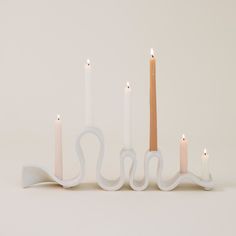 a group of candles sitting next to each other