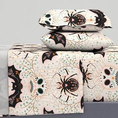 three sheets are stacked on top of each other in front of a gray background with black and white designs