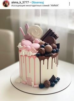 a cake decorated with chocolate, marshmallows and candy