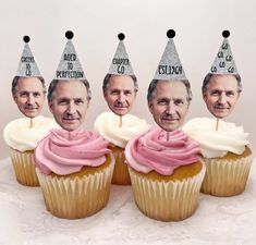 four cupcakes with photos of older men wearing party hats