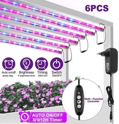 the led grow light is on display in front of purple flowers and green plants with pink flowers