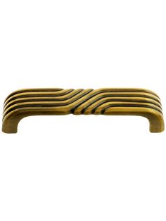 a brass plate with wavy lines on it