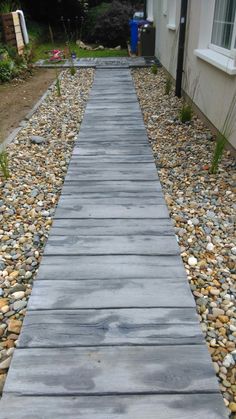 a walkway made out of rocks and gravel