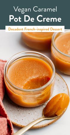 two small jars filled with sauce on top of a white plate