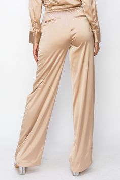 • SKU: P-2140• S-M-L• Hand wash onlyDiscover our Long High-Waist Pants, expertly crafted from premium polyester fabric for a sleek and stylish addition to your wardrobe. These versatile pants feature a flattering high-waisted silhouette that provides both comfort and support, making them the perfect choice for any occasion. Crafted from premium materials, these pants are soft, gentle on your skin, and perfect for any occasion, effortlessly transitioning from day to night. Wide Leg Full-length Pants With Pockets, Sleek Satin Pants, High Waist Solid Color Bottoms For Night Out, Sleek Satin Pants For Work, Spring Satin Straight Leg Pants, Solid Color Trousers For Night Out, Solid Color Trousers For A Night Out, Fitted Solid Color Trousers, Fitted Satin Bottoms For Night Out