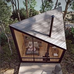 an aerial view of a small house with two children in it