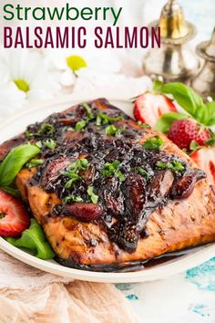 strawberry balsamic salmon on a plate with strawberries