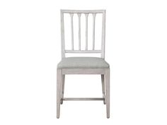 a white wooden chair with a gray seat