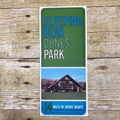 a sticker with the words sleeping bear dunes park on it's back side