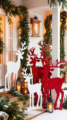 christmas decorations with deers and trees in front of a house