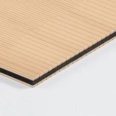 a close up view of the side of a wooden board with black lines on it