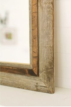 a wooden frame sitting on top of a white counter