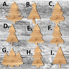 wooden christmas trees are arranged in the shape of letters and numbers on a wood background