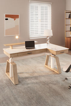 a desk with a laptop on it in a room