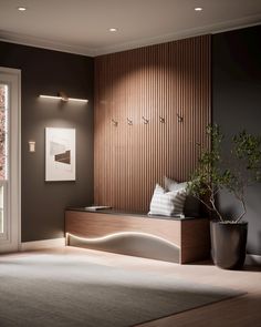 a living room with a couch, potted plant and sliding glass door