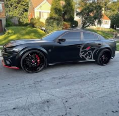 a black sports car parked on the street