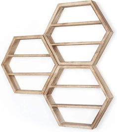 three wooden hexagonal shelves on the wall