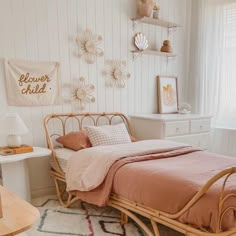 a bed room with a neatly made bed and a rug on the floor next to it