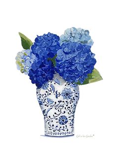 a blue and white vase with flowers in it