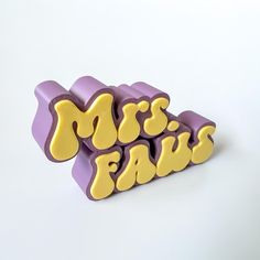 the word mrs fawc is made out of purple and yellow letters on a white background