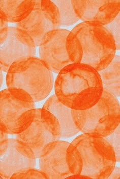 an orange and white background with circles on it