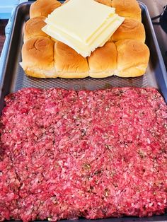 hamburger buns and cheese on a baking sheet