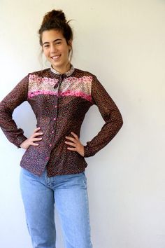 Lovely vintage 70s floral blouse in black with floral print in pink red yellow and green, buttons down, neck tie, polyester, somewhat sheer, original tag intact, aside from minor signs of wear, good vintage condition, clean, ready to wear.** Model is 5'8" and size S for reference  Tag size: 44Approximate size: S/M - please refer to the measurementsM E A S U R E M E N T S -were taken with garments laying flat, please double where necessary.————————————♥————Bust: 18.5"- 47 cmShoulder to Shoulder: Fitted Multicolor Blouse For Daywear, Fitted Floral Print Blouse With Tie Neck, Vintage Floral Print Blouse For Work, Vintage Floral Print Tops For Work, Vintage Printed Blouse For Work, Vintage Tie Neck Tops For Spring, Spring Retro Tie Neck Tops, Spring Retro Tie-neck Tops, Vintage Tie Neck Blouse For Fall