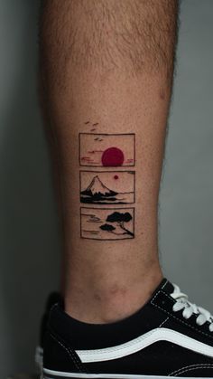 a man's foot with a small tattoo on the side of his leg that has mountains and sunset in it