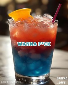 a blue and red drink with an orange slice on the rim