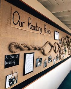 a bulletin board with rope and pictures on it that reads our reading roots, a love of reading