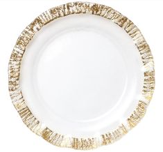 a white and gold plate on a white background