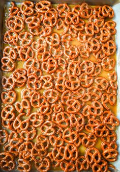 pretzels are being cooked in the oven and then placed on top of each other