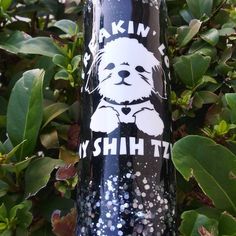 a black and white sticker with a dog on it's side that says, i am my shih tzu