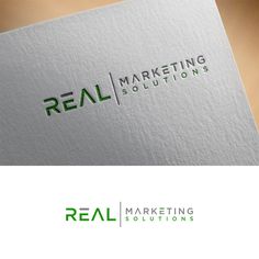 the logo for real marketing solutions is shown on top of a white and green business card