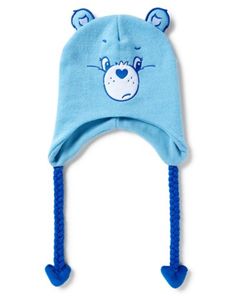 Stay warm, cozy, and cute with this Grumpy Care Bear laplander hat! This fun and attention-getting hat is perfect for any Care Bears fan! Officially licensed Adjustable Relaxed fit Material: Polyester Care: Spot clean Imported Care Bear Accessories, Cute Cap For Cold Weather, Cute Cold Weather Cap, Cute Warm Cotton Hat, Casual Beanie For Playtime, Playful Cotton Winter Hat, Playful Warm Cotton Hat, Warm Cotton Playful Hat, Warm Playful Cotton Hat