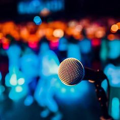 a microphone with blurry lights in the background