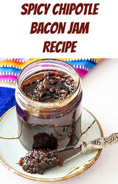 the recipe for spicy chipotle bacon jam is in a jar on a plate