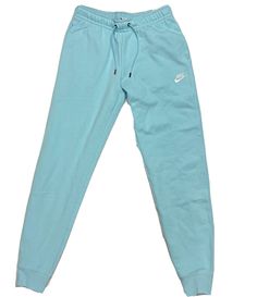 Sporty Light Blue Pants For Loungewear, Casual Blue Sweatpants For Leisure, Blue Joggers For Leisure In Sportswear Style, Blue Fleece Casual Activewear, Casual Blue Joggers For Leisure, Blue Athleisure Joggers For Leisure, Blue Leisure Bottoms With Comfort Waistband, Blue Athleisure Sweatpants For Leisure, Nike Sports Bottoms In Light Blue